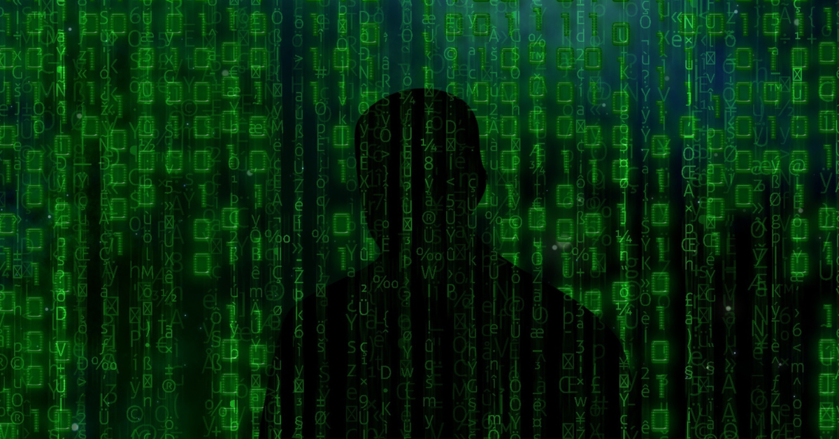 shadowy figure against a background of binary code
